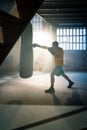 Young man boxing workout in an old building