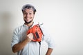 Young man bricolage working with electric saw