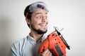 Young man bricolage working with electric saw