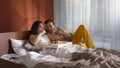 Young man bring breakfast in bed to asian boyfriend Royalty Free Stock Photo