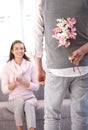Young man bringing flowers to woman Royalty Free Stock Photo