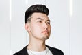Young man brunette with pompadour volume haircut 50s - 60s. real photo retro hair style for barbershop Royalty Free Stock Photo