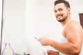 Young man brushing his teeth in a bathroom Royalty Free Stock Photo