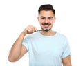 Young man brushing teeth on white Royalty Free Stock Photo