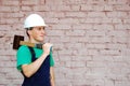 Young man in a builder uniform. Royalty Free Stock Photo