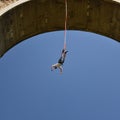 Young man bungee jumper hanging on a cord Royalty Free Stock Photo