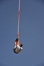 Young man bungee jumper hanging on a cord Royalty Free Stock Photo