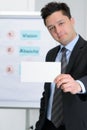 Young man with business card Royalty Free Stock Photo