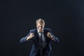 Young man in a business suit rolled up his sleeves and Boxing. Aggressive business, concept.