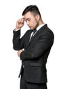 Young man in business suit, thinking about something, isolated on a white background Royalty Free Stock Photo