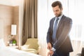 Young man business traveler hotel room accomodation Royalty Free Stock Photo
