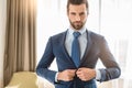 Young man business traveler hotel room accomodation Royalty Free Stock Photo