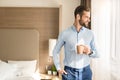 Young man business traveler hotel room accomodation Royalty Free Stock Photo