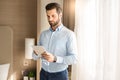 Young man business traveler hotel room accomodation Royalty Free Stock Photo