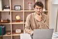 Young man business worker using laptop with serious expression at office Royalty Free Stock Photo