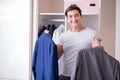 The young man businessman getting dressed for work Royalty Free Stock Photo