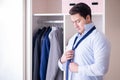 The young man businessman getting dressed for work Royalty Free Stock Photo