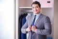 The young man businessman getting dressed for work Royalty Free Stock Photo