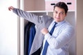 The young man businessman getting dressed for work Royalty Free Stock Photo