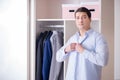 The young man businessman getting dressed for work Royalty Free Stock Photo
