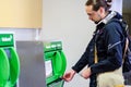 Young man buying train ticket Royalty Free Stock Photo