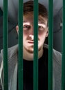 Young Man in a Cage Royalty Free Stock Photo