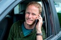 Young man is calling in the car Royalty Free Stock Photo