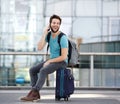 Young man calling by mobile phone at airport Royalty Free Stock Photo