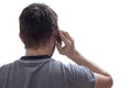 Young man is calling using smartphone. View from behind. Isolated on white background