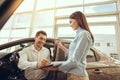 Young Man in a Car Rental Service Test Drive Concept