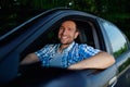Young man in car smiling Royalty Free Stock Photo