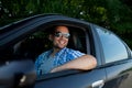 Young man in car smiling Royalty Free Stock Photo
