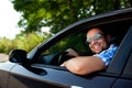 Young man in car smiling Royalty Free Stock Photo
