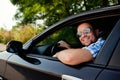 Young man in car smiling Royalty Free Stock Photo