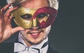 Young man in carnival mask on dark Royalty Free Stock Photo