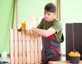 Young man carpenter working in workshop Royalty Free Stock Photo