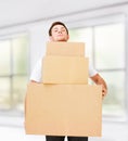 Young man carrying carton boxes Royalty Free Stock Photo