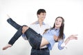 Young man carrying girlfriend in his arms Royalty Free Stock Photo