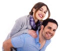 Young man carrying his girlfriend at the back Royalty Free Stock Photo