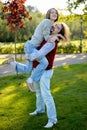 Young man carrying his pretty girlfriend Royalty Free Stock Photo