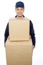 Young man carrying huge cardboard boxes Royalty Free Stock Photo