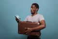 Young man carrying suitcase and running late for vacation trip Royalty Free Stock Photo