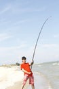 A young man catches a fish Royalty Free Stock Photo