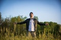 Young man celebrating nature and freedom