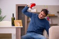 Young man celebrating Christmas alone at home Royalty Free Stock Photo