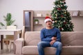 Young man celebrating Christmas alone at home Royalty Free Stock Photo