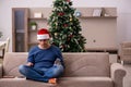 Young man celebrating Christmas alone at home Royalty Free Stock Photo