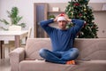 Young man celebrating Christmas alone at home Royalty Free Stock Photo