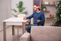 Young man celebrating Christmas alone at home Royalty Free Stock Photo