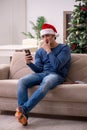 Young man celebrating Christmas alone at home Royalty Free Stock Photo